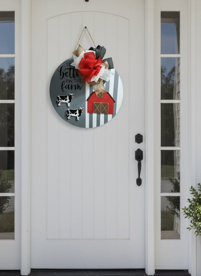 'LIFE IS BETTER ON THE FARM'
18" Gray & White wooden door sign with coordinating bow and barn with cows.